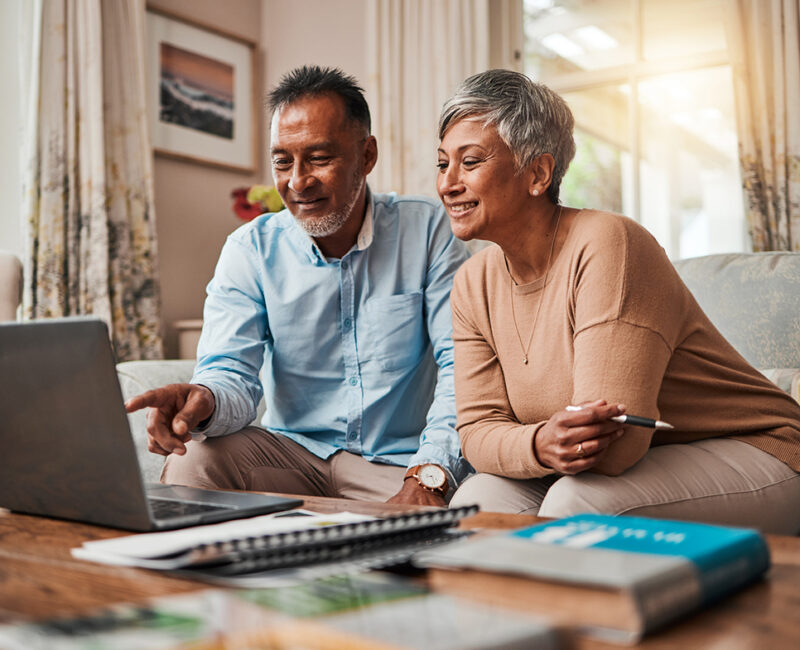 older couple looking at laptop for retirement planning